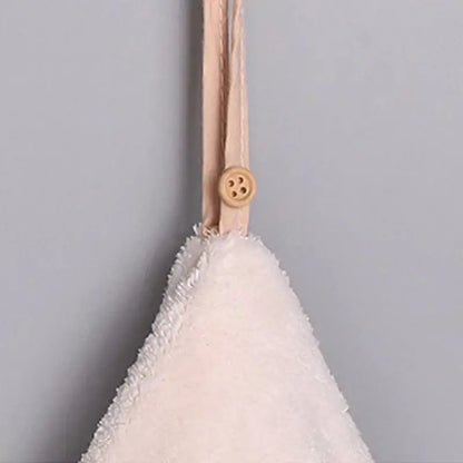 Off-white microfiber hand towel with fluffy texture and beige strap with wooden button in decorbites coral velvet set