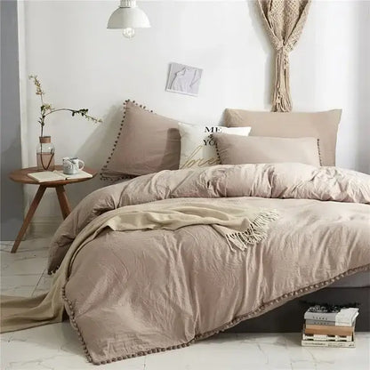 Beige textured duvet cover set with matching pillowcases and fringe trim for a mint green quilted pom pom cover set