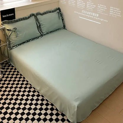 Mint green satin cotton embroidery bedding set with ruffled pillowcases, matching bows, and gray trim decorbites cotton embroidery