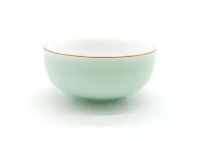 A delicate mint green celadon tea cup set with white porcelain and a subtle gold rim by decorbites celadon tea
