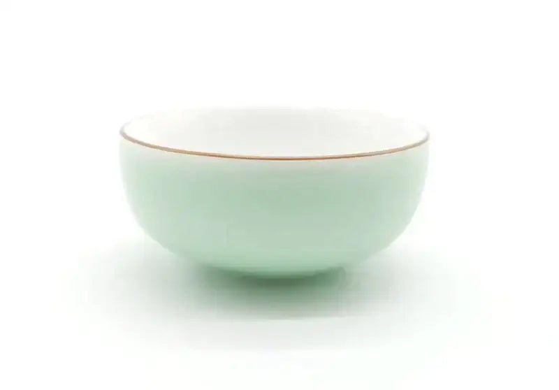 A delicate mint green celadon tea cup set with white porcelain and a subtle gold rim by decorbites celadon tea