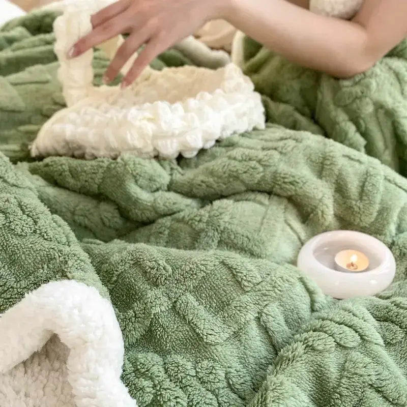 A mint green and white coral fleece blanket by decorbites with plush, textured, and warm cozy fabric