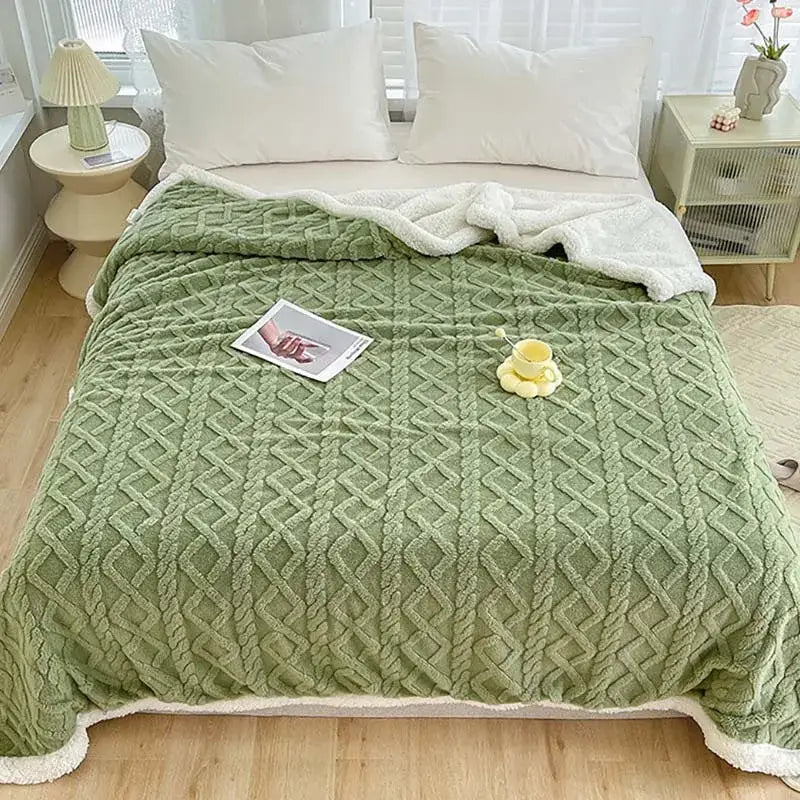 A cozy olive green decorbites coral fleece blanket with textured diamond pattern and soft white sherpa lining