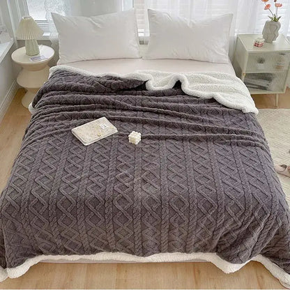 A cozy gray knit decorbites coral fleece blanket with plush white fleece lining and diamond-patterned texture for warmth