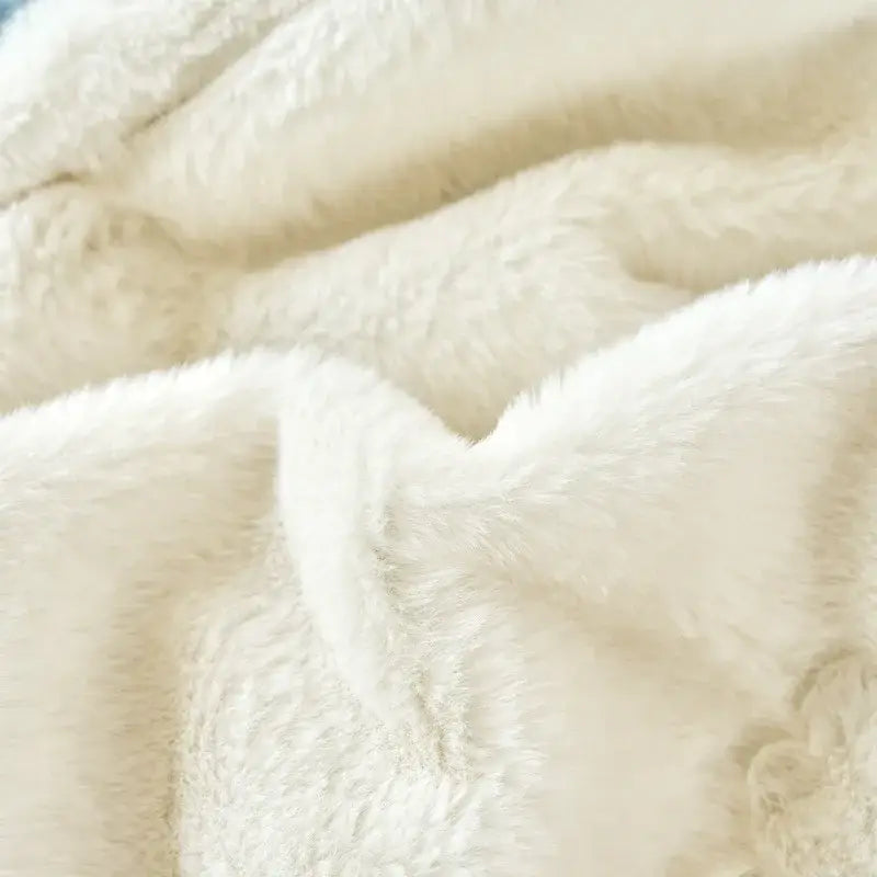 Cream-colored plush mint and white cozy faux rabbit fur blanket with soft fluffy texture for bedroom decorbites cozy faux use