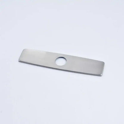 A sleek stainless steel rectangular deck plate escutcheon with a central hole for kitchen and bathroom sinks