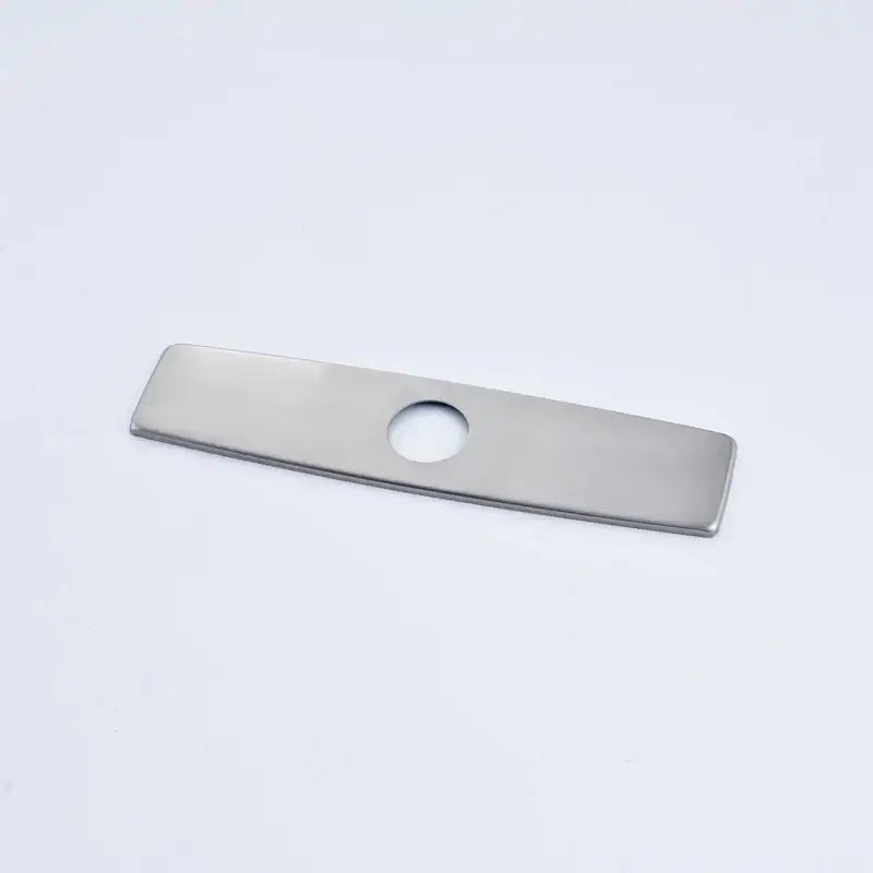 A sleek stainless steel rectangular deck plate escutcheon with a central hole for kitchen and bathroom sinks