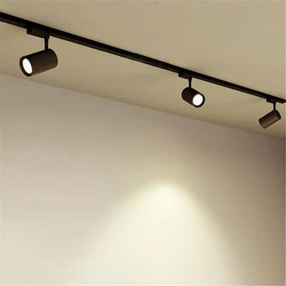 Black cylindrical track lights with adjustable heads on a 100cm black white rail for living room decorbites 100cm black