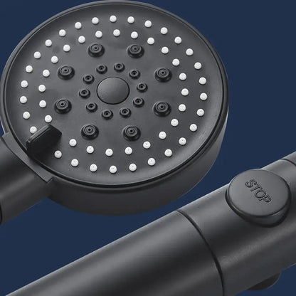 Modern 5-function shower head with black matte finish white nozzles and central control knob for versatile use