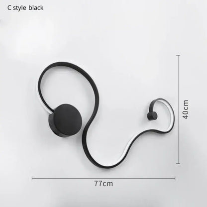 Modern abstract black iron body wall lamp with sleek curved metallic frame for bedroom and living room decorbites iron body