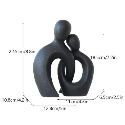 Black matte ceramic couple love sculpture with abstract stylized figures for modern living room decorbites couple love