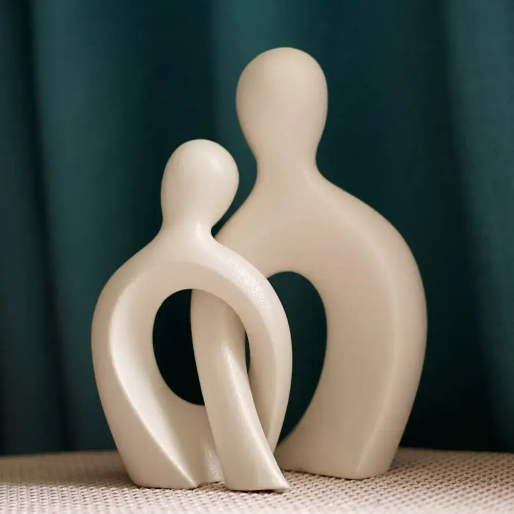 Cream-colored ceramic couple love sculpture with abstract human forms for modern living room decorbites couple decor