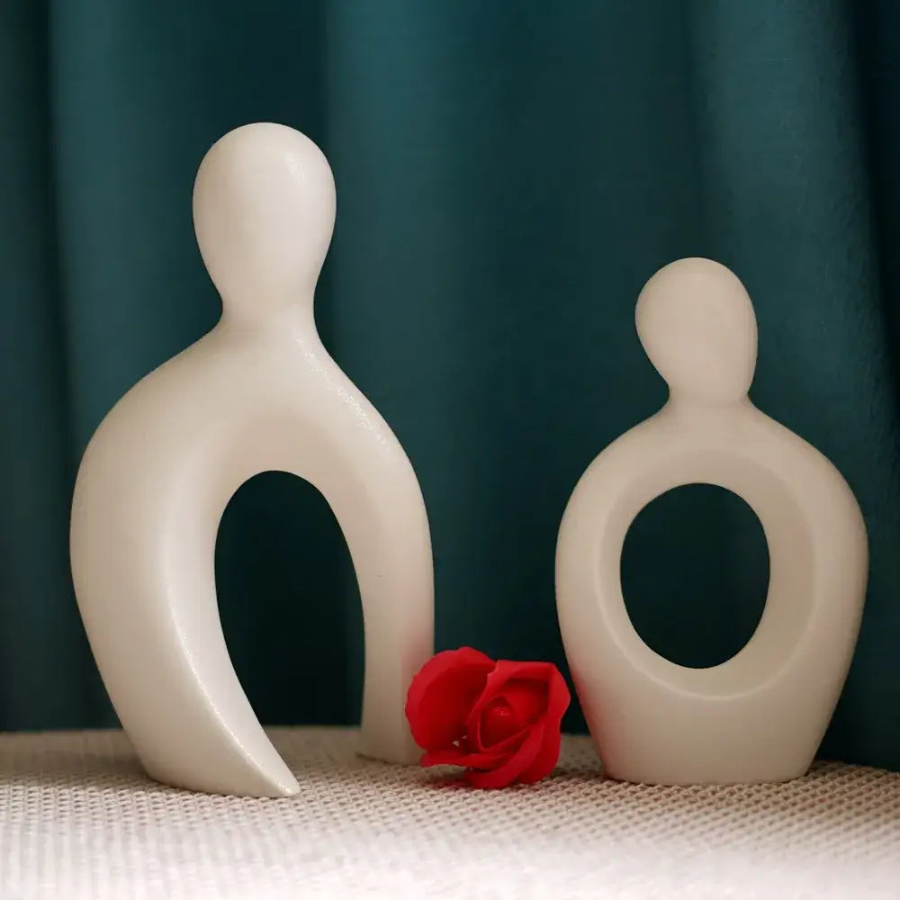 Cream-colored modern abstract ceramic couple love sculpture with smooth glossy surfaces for living room decorbites couple love