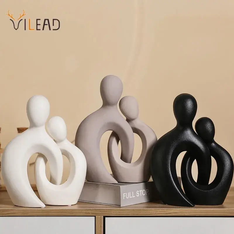Set of three abstract white beige and black ceramic couple love sculpture figurines with smooth matte finish for living room decorbites couple love