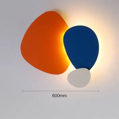 Modern abstract geometric art wall lamp with three overlapping shapes in orange blue and white for bedroom and living room