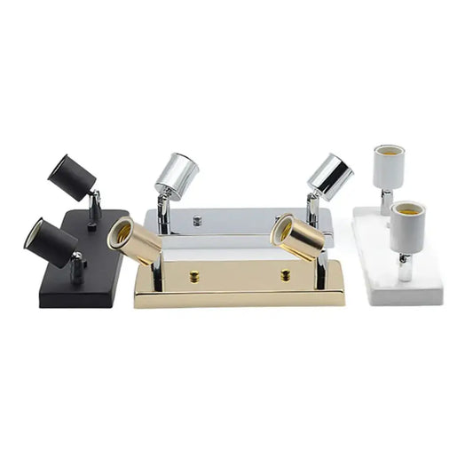 Set of three modern adjustable ceramic ceiling lights in black chrome and gold finishes with matching rectangular bases