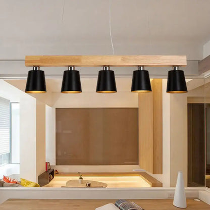 DecorBites™ modern adjustable cone pendant lamp in black with warm brass interior on light wood beam fits e26 e27 bulbs