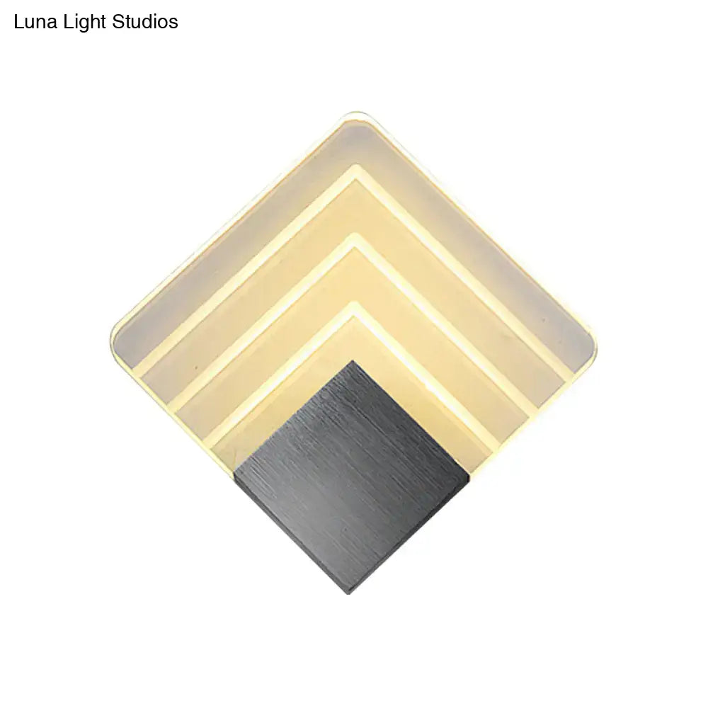Modern aged silver and black square led wall sconce with layered translucent panels and brushed metal base for bedroom lighting