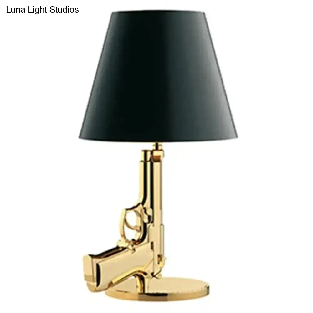 Modern ak47 gun lounge floor lamp with silvery gold lustre pistol base and black conical shade for bedroom lighting