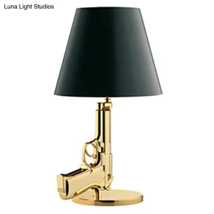 Modern ak47 gun lounge floor lamp in gold with silvery gold lustre and black conical shade for bedroom lighting
