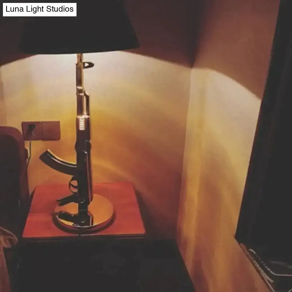 Modern ak47 gun lounge floor lamp with rifle-shaped black base and silvery gold lustre for bedroom lighting