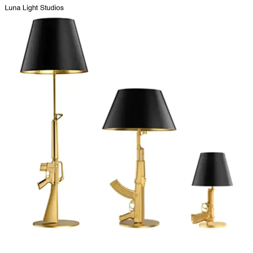 Set of three modern ak47 gun lounge floor lamps with silvery gold lustre finish and black conical shades by Luna Light Studios
