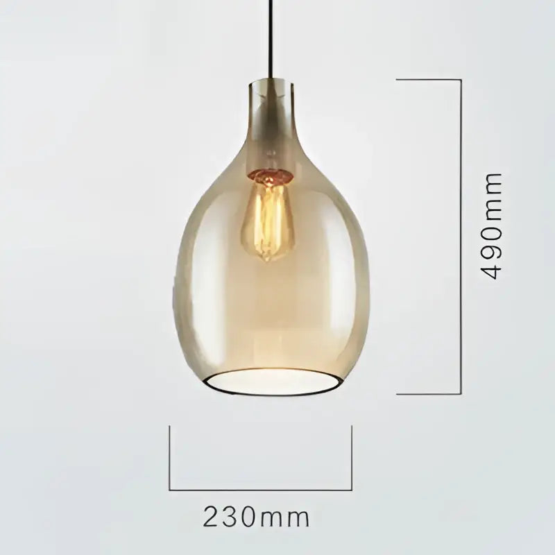 A sleek amber glass pendant light with visible filament bulb, part of modern kitchen glass pendant lights collection