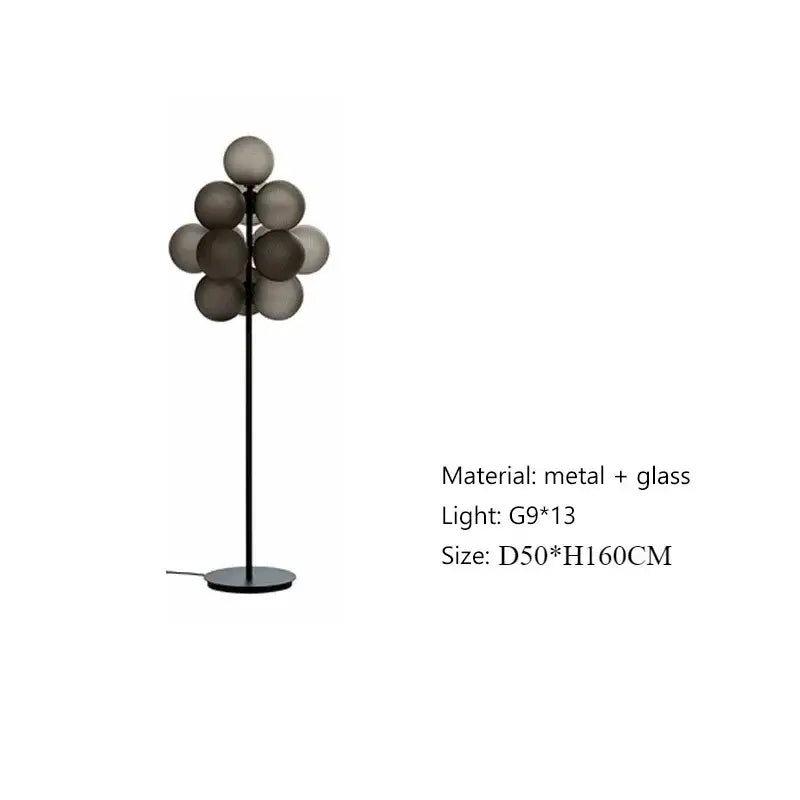 Modern amber bubble glass lamp set featuring a slender black metal stand and gray spherical shades for living room use
