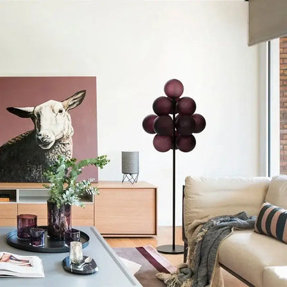 Modern amber bubble glass floor and table lamp set with deep burgundy spherical globes on black metal stand
