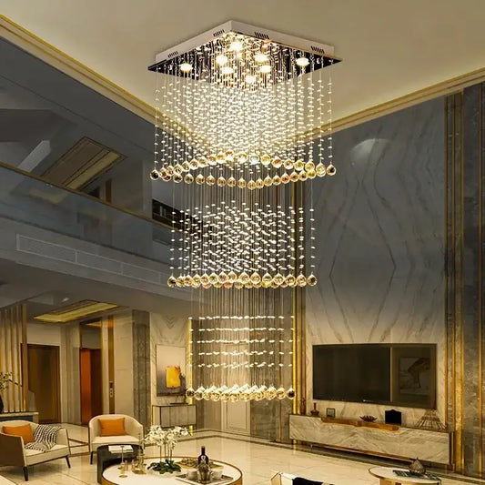 Modern amber and clear decorbites crystal teardrop stairwell chandelier with cascading tiers from sleek metallic frame