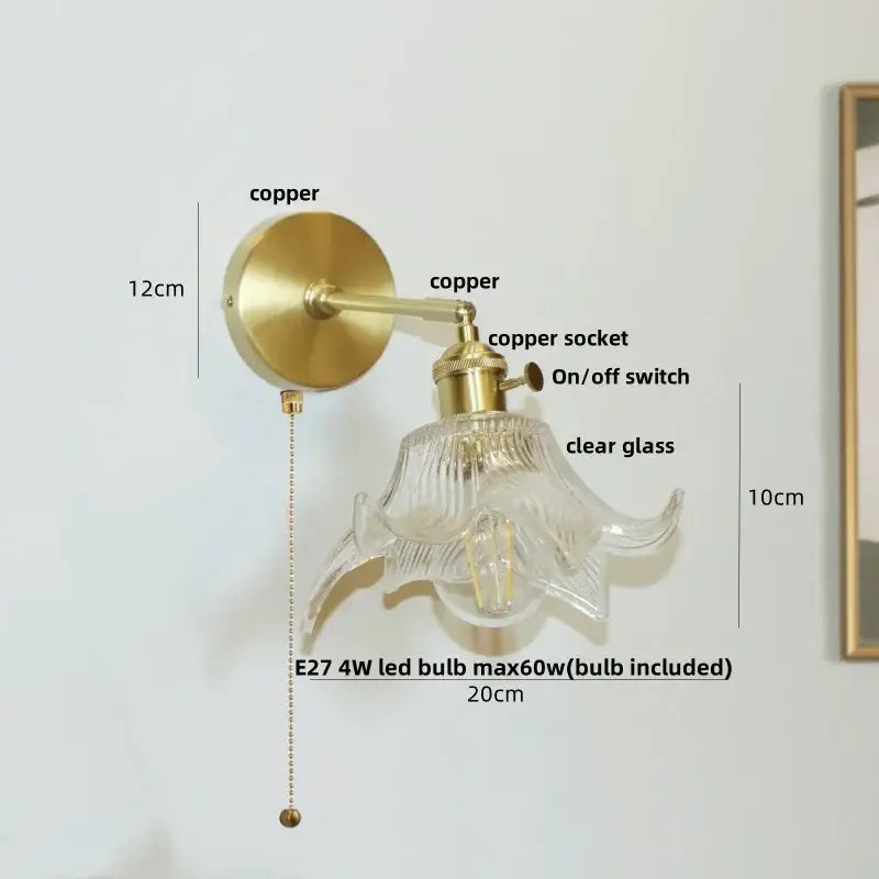 Modern amber clear glass wall sconce with brass copper finish and fluted flower-shaped clear glass shade decorbites clear glass