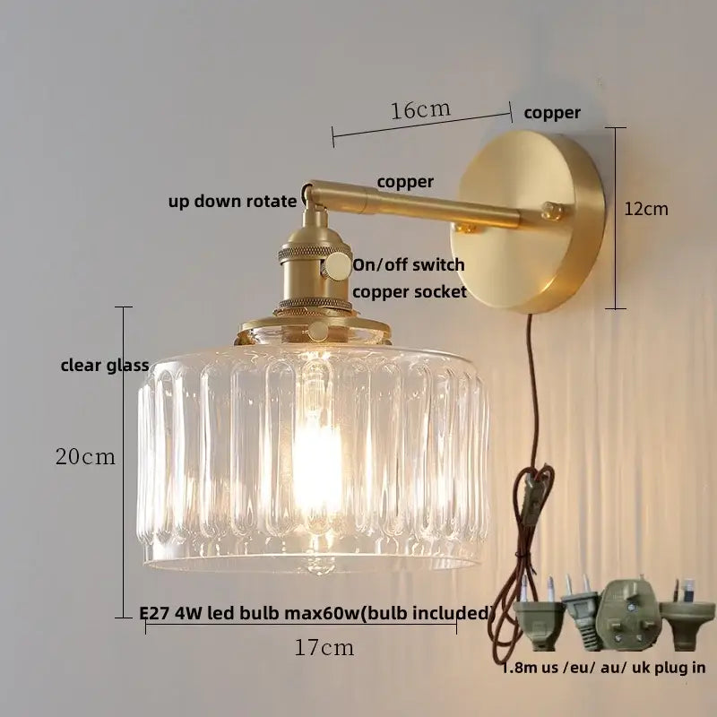 Copper-finished wall sconce with clear ribbed glass shade perfect for modern amber clear glass decorbites clear glass lighting