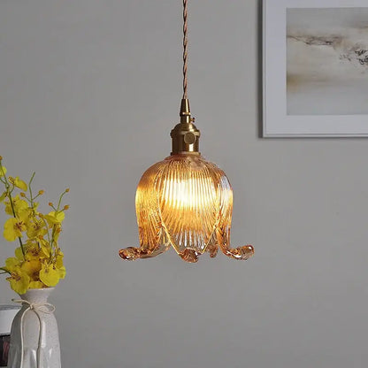 A modern amber copper glass led pendant light with ribbed petal design and brass hardware for kitchen decorbites copper glass