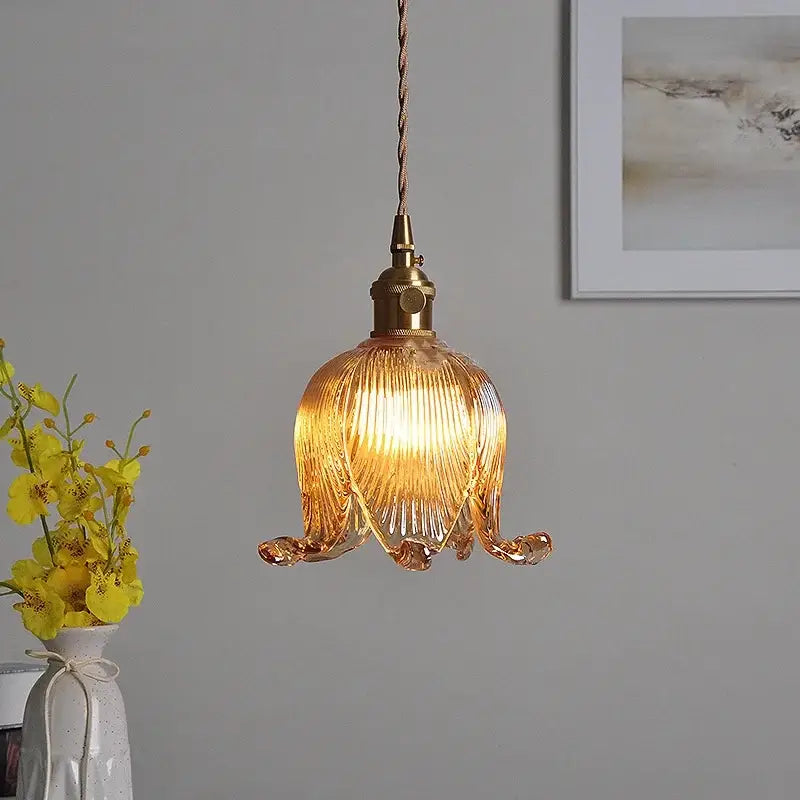 A modern amber copper glass led pendant light with ribbed petal design and brass hardware for kitchen decorbites copper glass