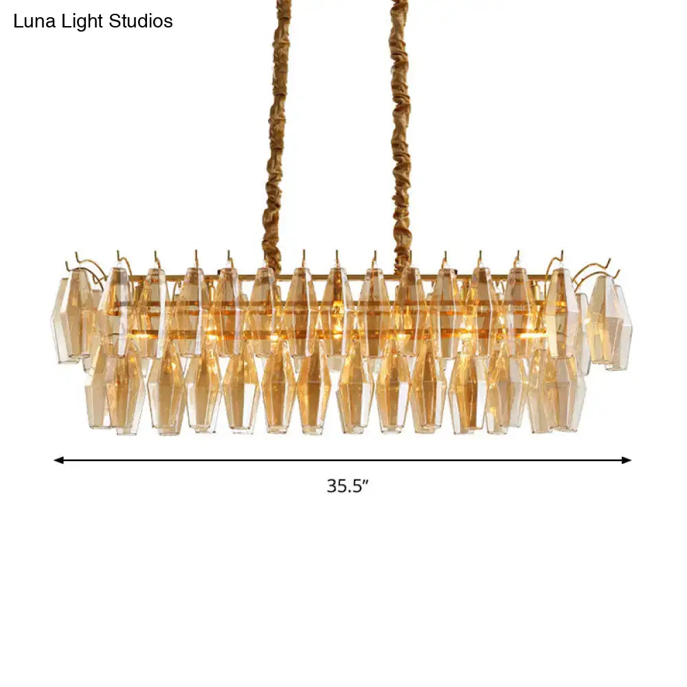 Gold-toned modern amber crystal oval island light fixture with faceted crystal droplets for dining room