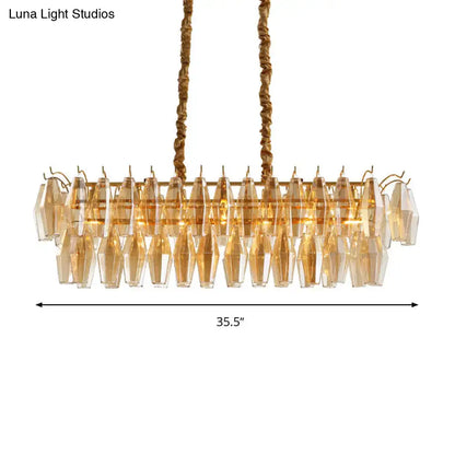 Gold-toned modern amber crystal oval island light fixture with faceted crystal droplets for dining room