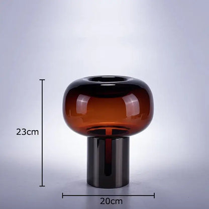 A sleek amber-tinted decorbites dark glass vase with rounded top and cylindrical base for modern office desk decor