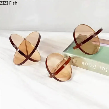 Modern amber acrylic geometric cross ornaments with dark brown edges by zizi fish for living room decorbites bookends