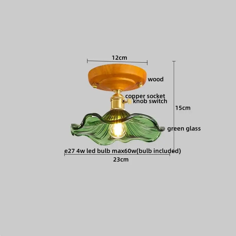 Modern amber glass and brass led ceiling lamp with a green glass leaf pendant light wooden base and copper socket