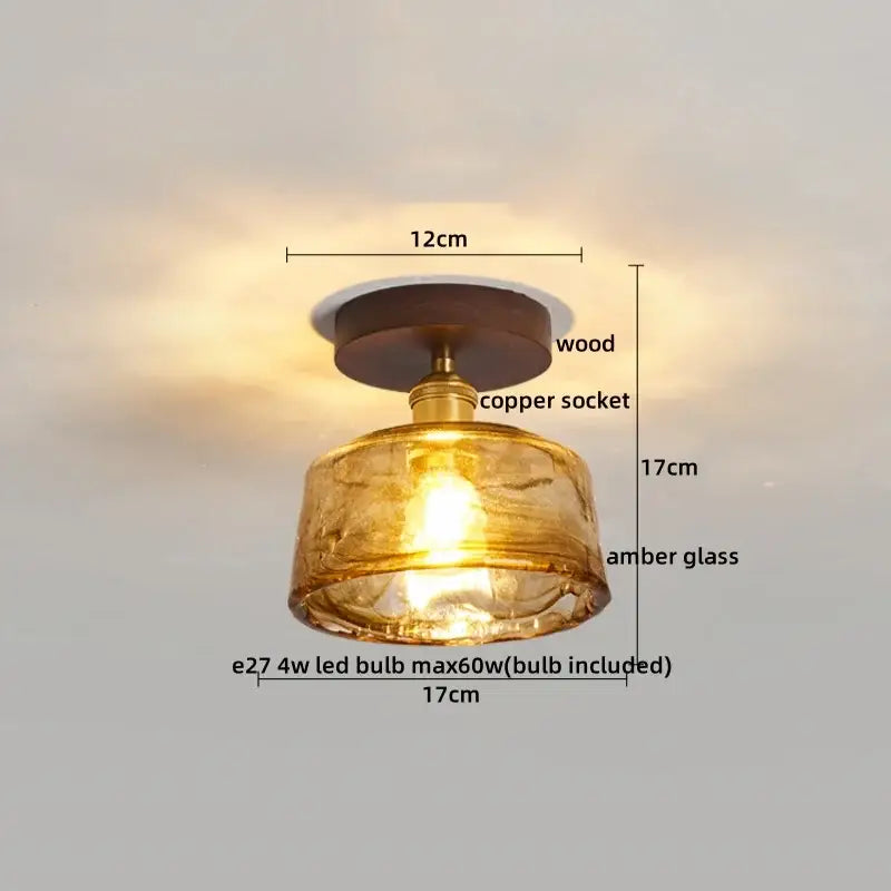 Modern amber glass and brass led ceiling lamp featuring a warm amber glass pendant with wooden base and copper socket