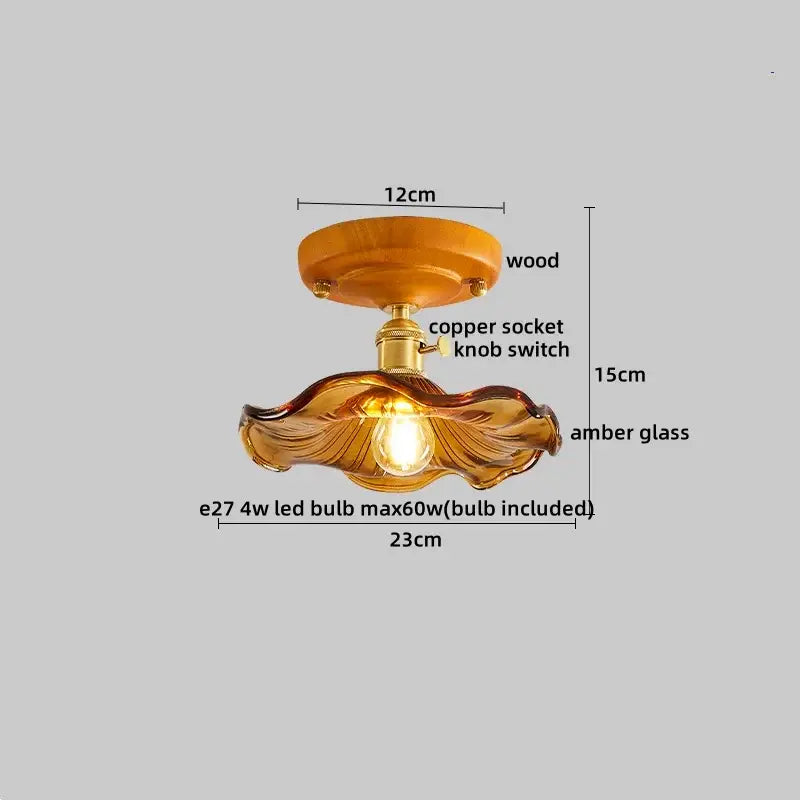 Modern amber glass and brass led ceiling lamp with wooden mount and copper socket featuring elegant leaf design