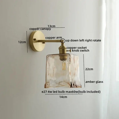 Modern amber glass copper led wall lamp with a textured faceted design and brass copper hardware bedroom sconce