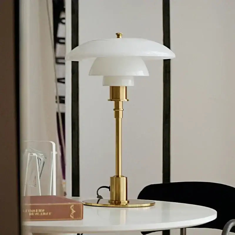Elegant white layered decorbites glass desk lamp with polished golden brass base for modern living room decor