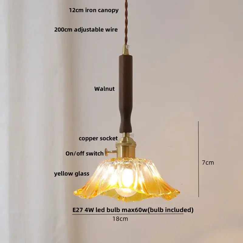 Modern amber glass led pendant light with delicate yellow glass, walnut wood canopy, copper socket, and adjustable wire
