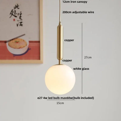 Modern amber glass led pendant light with frosted white globe and copper tone metal for dining room illumination