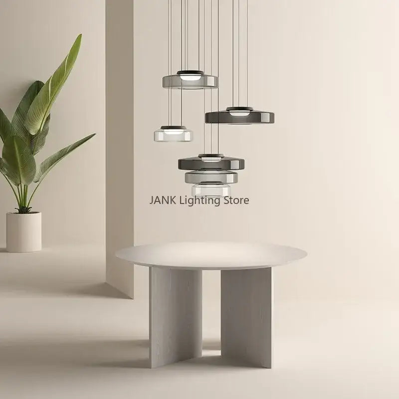 Modern amber glass chandelier led pendant lights with sleek metal shades in varying sizes for dining room illumination