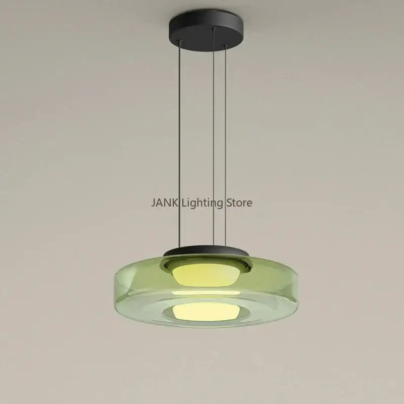 Modern amber glass chandelier led pendant with translucent green glass disc and warm led lights for dining room lighting