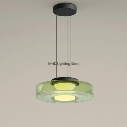 Modern amber glass chandelier led pendant with translucent green glass disc and warm led lights for dining room lighting