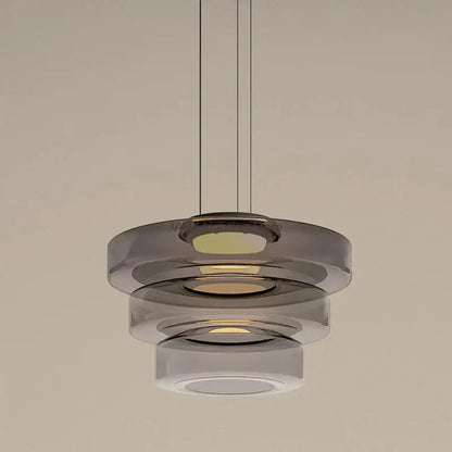 Modern amber glass chandelier led pendant with tiered smoked glass rings and warm led illumination for dining room