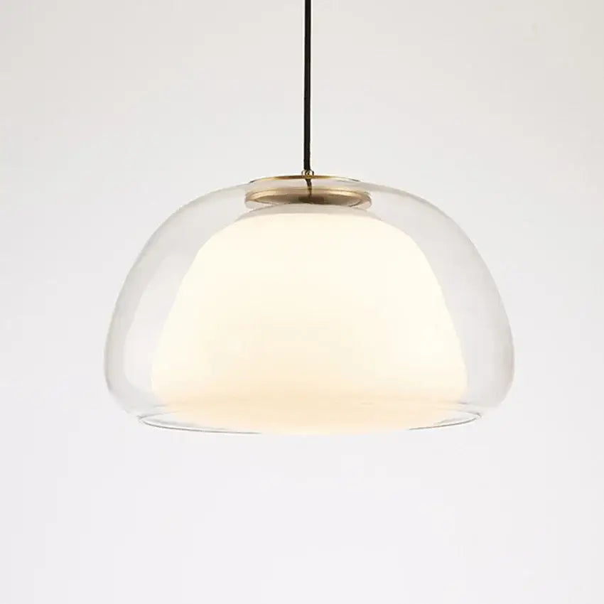 Modern amber and gray double glass pendant light with brass accents and warm glow for dining room lighting